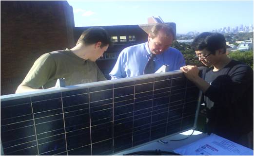 My dad, Tom and I working on our solar panel 